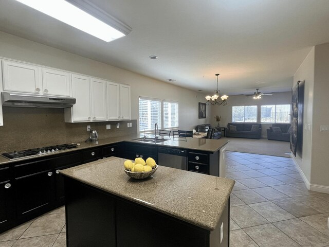 2604 W Taylor, Visalia, CA 93291 - kitchen featuring under cabinet range hood, appliances with stainless steel finishes, a sink, a center island, and open floor plan