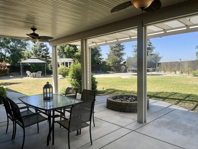 2604 W Taylor, Visalia, CA 93291 - view of patio featuring a trampoline, a gazebo, ceiling fan, outdoor dining space, and a pergola