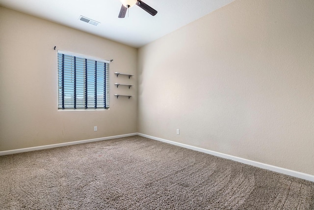 spare room featuring ceiling fan, baseboards, and carpet
