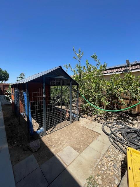 290 Cabrillo Dr, Coalinga, CA 93210 - view of patio with an outbuilding