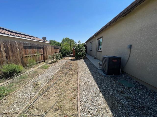 290 Cabrillo Dr, Coalinga, CA 93210 - fenced backyard with central air condition unit