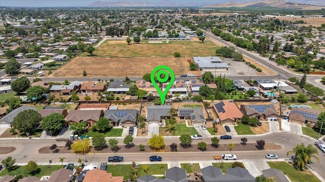 1601 El Paso, Dinuba, CA 93618 - aerial view of property and surrounding area featuring nearby suburban area and a mountain backdrop