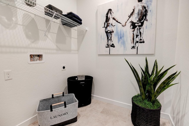 1173 Maclure Ave W, Madera, CA 93636 - clothes washing area with hookup for an electric dryer, hookup for a washing machine, and baseboards