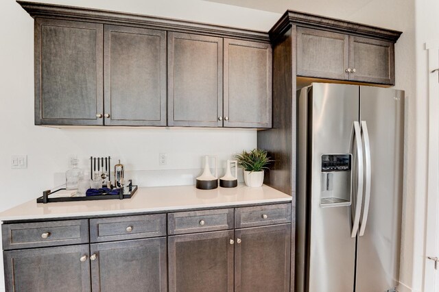 1173 Maclure Ave W, Madera, CA 93636 - kitchen featuring stainless steel fridge with ice dispenser, dark brown cabinets, and light countertops