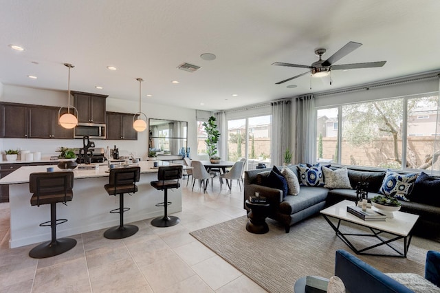 1173 Maclure Ave W, Madera, CA 93636 - living room featuring plenty of natural light, ceiling fan, recessed lighting, and light tile patterned flooring