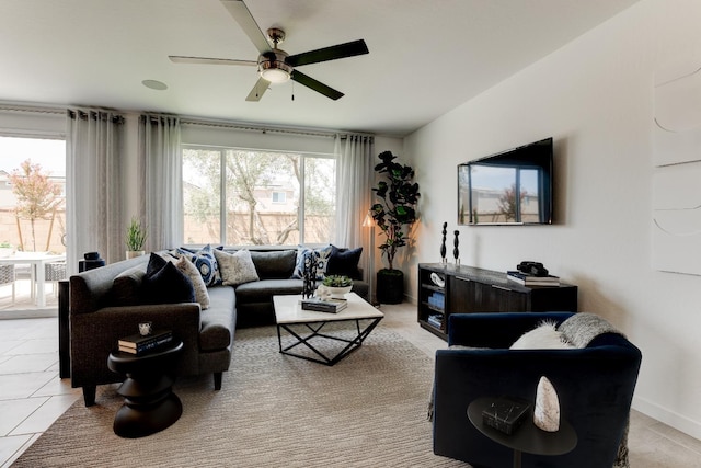 1173 Maclure Ave W, Madera, CA 93636 - living room with ceiling fan, light tile patterned floors, and baseboards