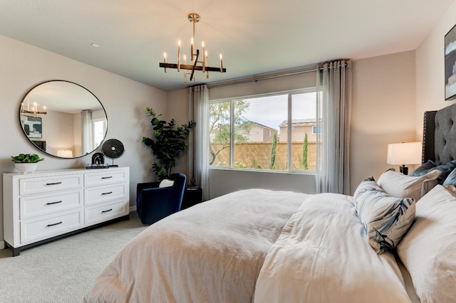 1173 Maclure Ave W, Madera, CA 93636 - bedroom with a chandelier, carpet floors, and multiple windows