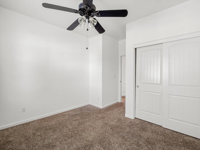 1585 Dallas St, Dinuba, CA 93618 - unfurnished bedroom with carpet floors, a closet, baseboards, and a ceiling fan