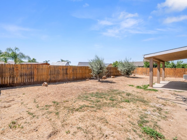 1585 Dallas St, Dinuba, CA 93618 - fenced backyard featuring a patio