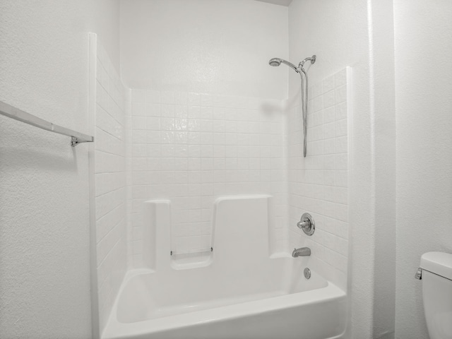 1585 Dallas St, Dinuba, CA 93618 - full bathroom with toilet, tub / shower combination, and a textured wall