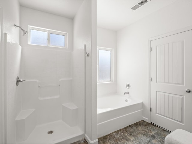 1585 Dallas St, Dinuba, CA 93618 - full bathroom featuring a shower, stone finish floors, and a bath