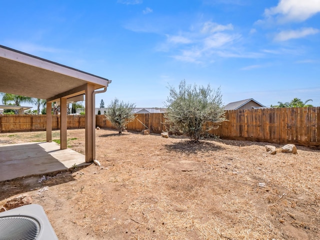 1585 Dallas St, Dinuba, CA 93618 - fenced backyard with a patio
