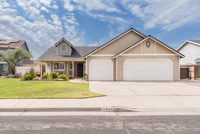 view of front of property with a garage, driveway, and a shingled roof