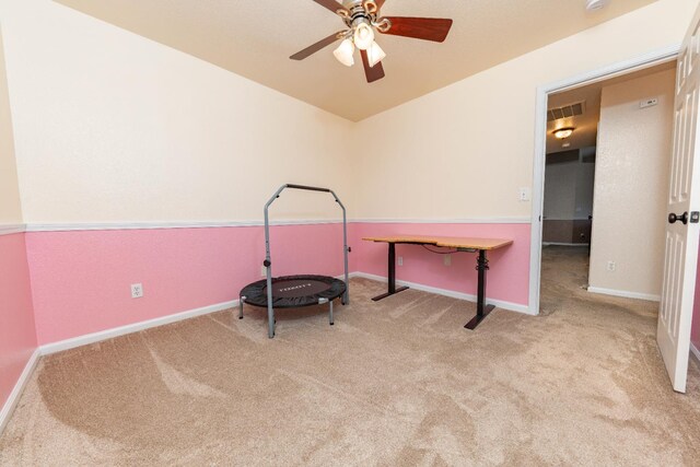 rec room with carpet floors, a ceiling fan, and baseboards