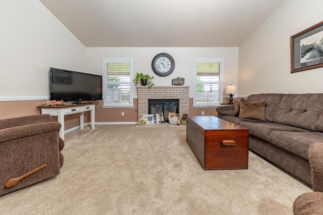 living room with carpet floors, a brick fireplace, baseboards, and vaulted ceiling