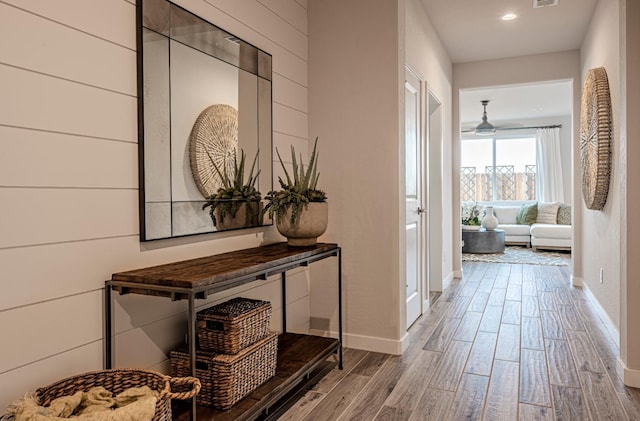 1161 Maclure Ave W, Madera, CA 93636 - hall with wood finished floors, baseboards, and recessed lighting