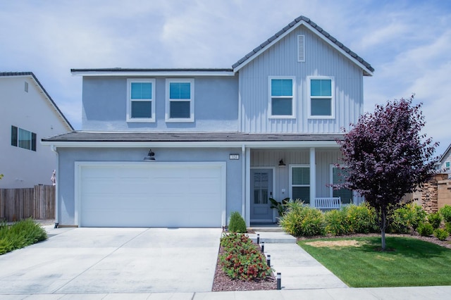 324 Sunset Dr S, Madera, CA 93636 - traditional-style home with covered porch, concrete driveway, a garage, and stucco siding