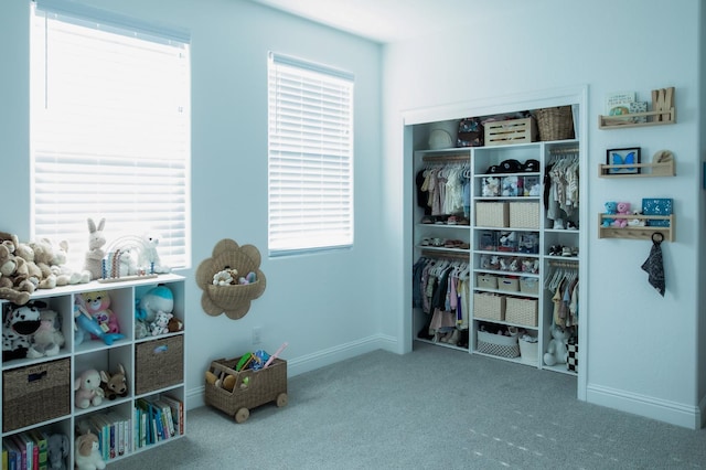 324 Sunset Dr S, Madera, CA 93636 - recreation room featuring carpet floors, baseboards, and plenty of natural light