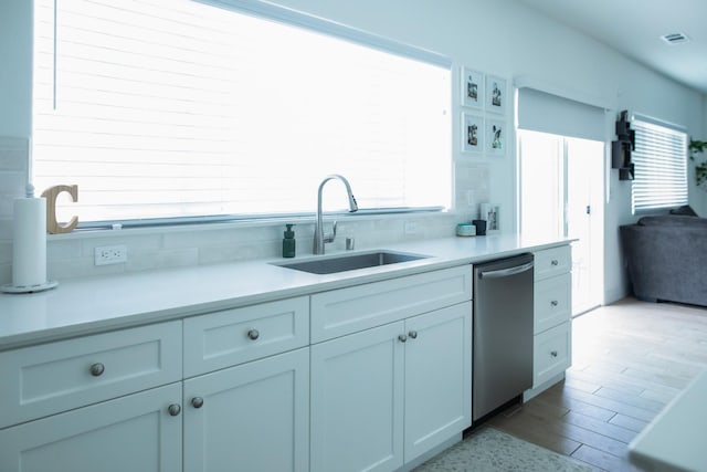 324 Sunset Dr S, Madera, CA 93636 - kitchen with a sink, dishwasher, light countertops, and plenty of natural light