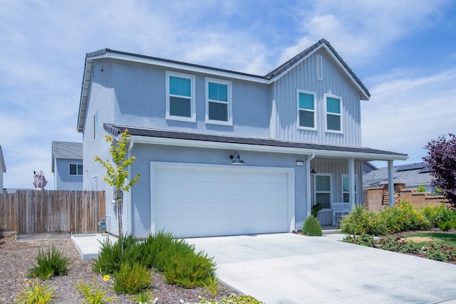 324 Sunset Dr S, Madera, CA 93636 - traditional-style house with fence, an attached garage, concrete driveway, stucco siding, and a porch