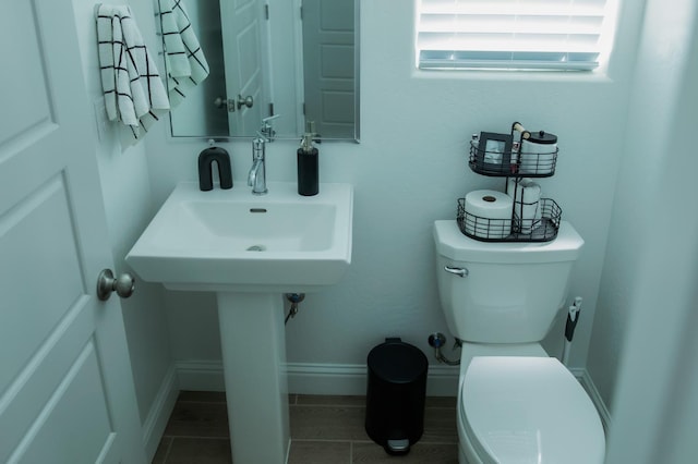 324 Sunset Dr S, Madera, CA 93636 - half bathroom with toilet, tile patterned flooring, and baseboards