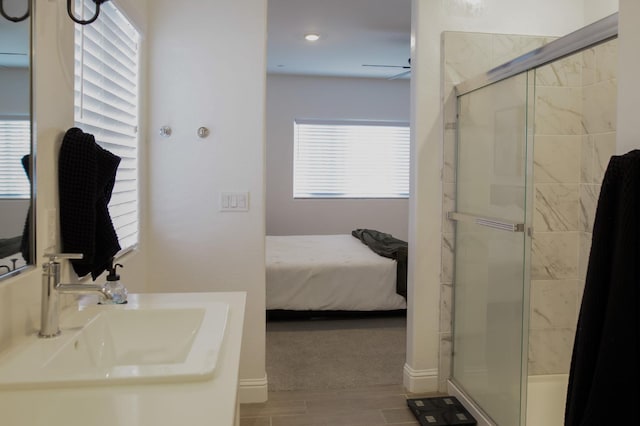 324 Sunset Dr S, Madera, CA 93636 - ensuite bathroom with a sink, a shower stall, and wood finished floors