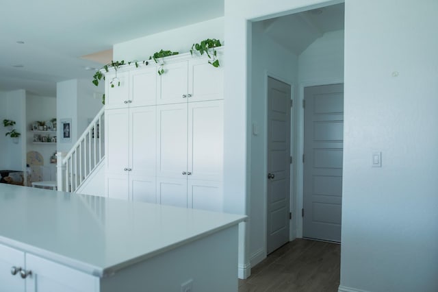 324 Sunset Dr S, Madera, CA 93636 - kitchen with wood finished floors, white cabinetry, baseboards, and light countertops