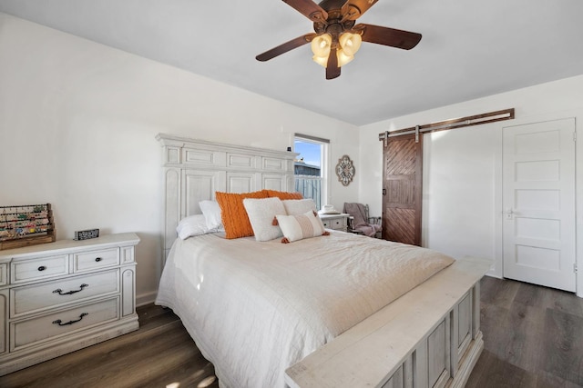 261 Belmont Rd, Exeter, CA 93221 - bedroom featuring dark wood finished floors, a barn door, and ceiling fan