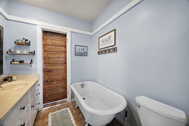 261 Belmont Rd, Exeter, CA 93221 - bathroom featuring vanity, a freestanding bath, and toilet
