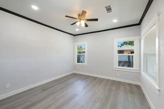 705 Poplar, Fresno, CA 93728 - unfurnished room featuring crown molding, ceiling fan, wood finished floors, baseboards, and recessed lighting