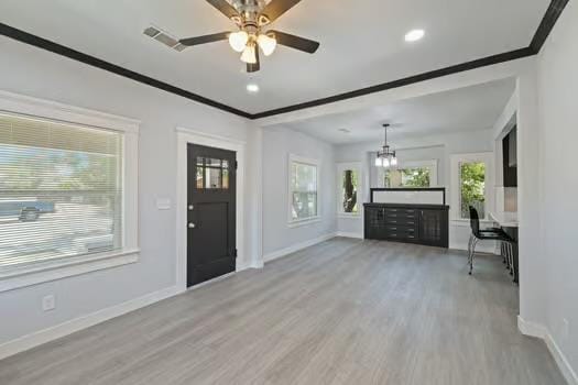 705 Poplar, Fresno, CA 93728 - entrance foyer featuring baseboards, ornamental molding, light wood-style floors, a chandelier, and ceiling fan