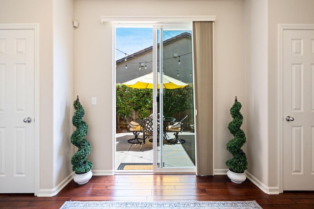 3942 Harlan Ranch Blvd, Clovis, CA 93619 - doorway to outside featuring wood-type flooring and baseboards
