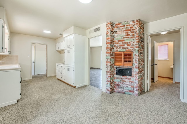 3757 E Farrin Ave, Fresno, CA 93726 - kitchen featuring white cabinetry, light carpet, and light countertops