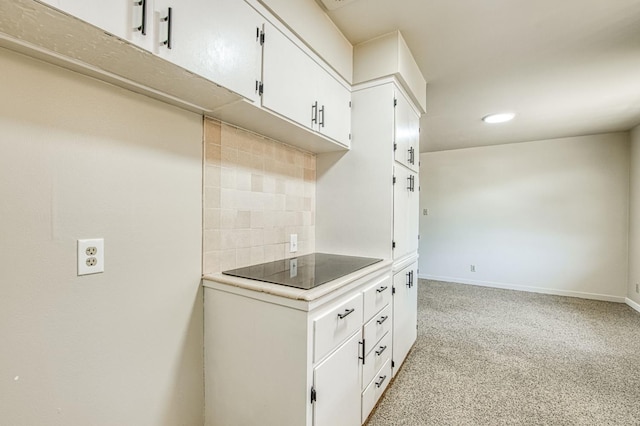 3757 E Farrin Ave, Fresno, CA 93726 - kitchen with backsplash, white cabinetry, light countertops, recessed lighting, and baseboards
