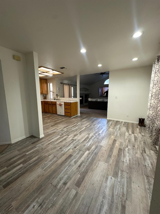 5838 W Fallon Ave, Fresno, CA 93722 - unfurnished living room with ceiling fan, dark wood finished floors, baseboards, and recessed lighting