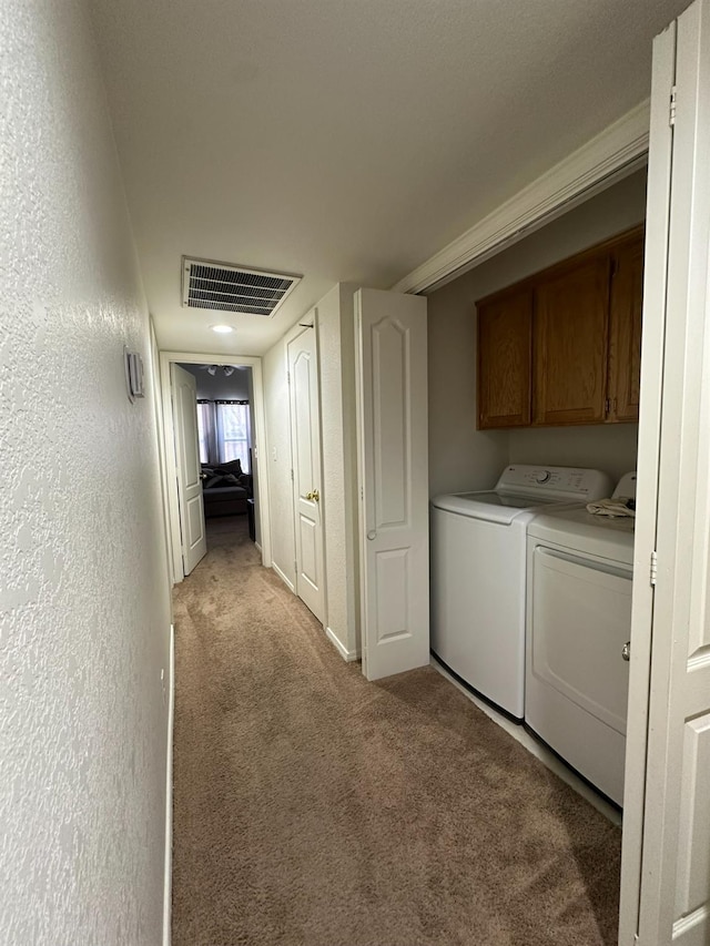 5838 W Fallon Ave, Fresno, CA 93722 - laundry area featuring light carpet and separate washer and dryer