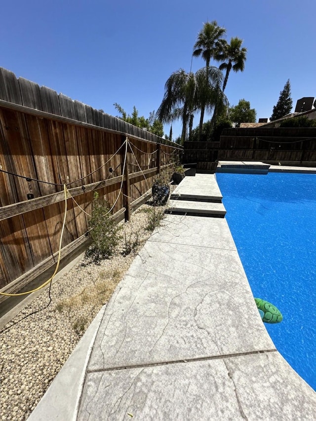 5838 W Fallon Ave, Fresno, CA 93722 - view of swimming pool with a fenced backyard
