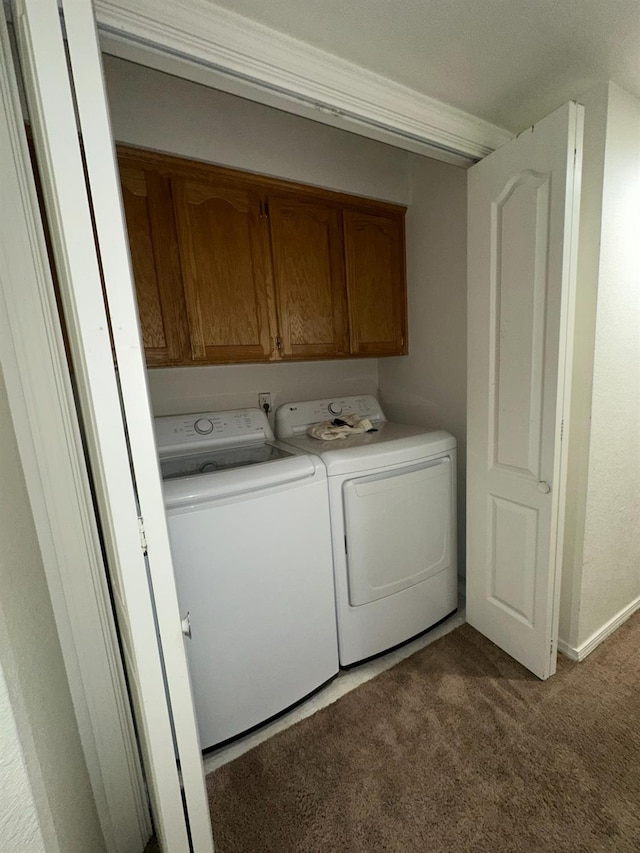 5838 W Fallon Ave, Fresno, CA 93722 - laundry area featuring independent washer and dryer, carpet floors, and cabinet space