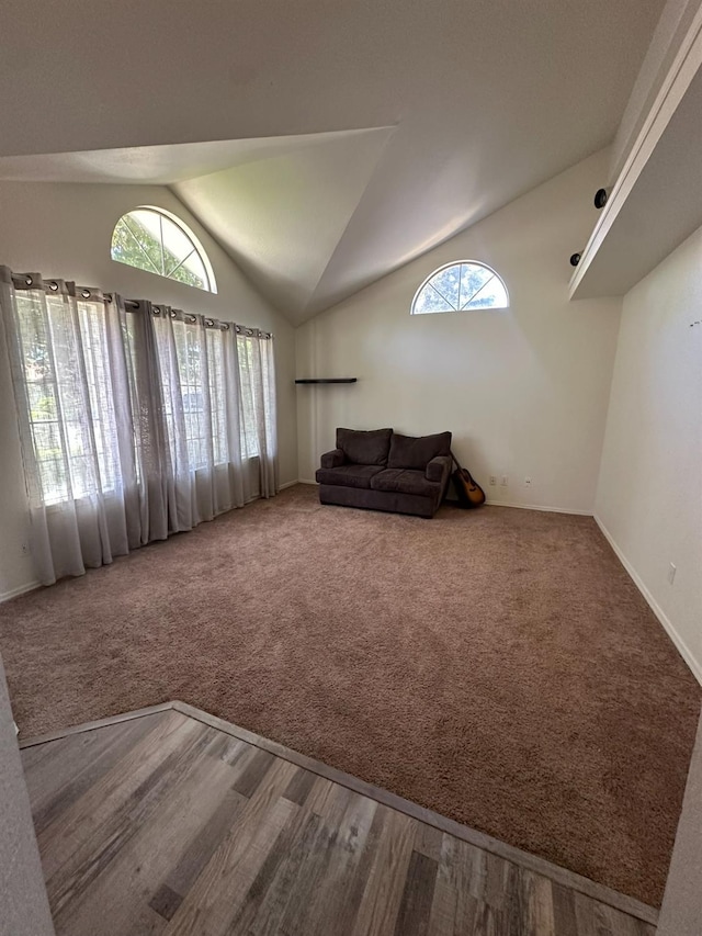 5838 W Fallon Ave, Fresno, CA 93722 - carpeted living area with lofted ceiling and baseboards