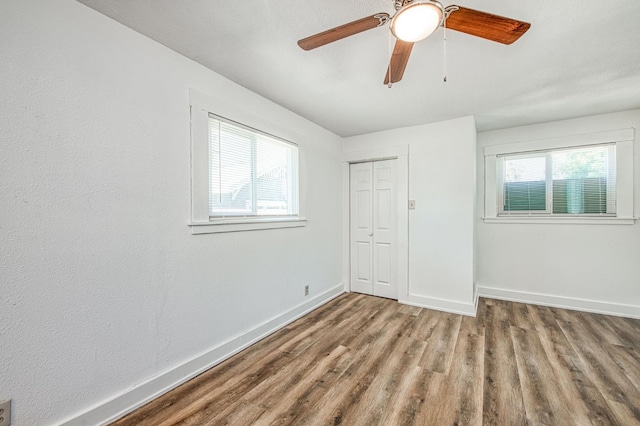 1010 N Ferger Ave, Fresno, CA 93728 - unfurnished bedroom with wood finished floors, baseboards, a closet, and ceiling fan
