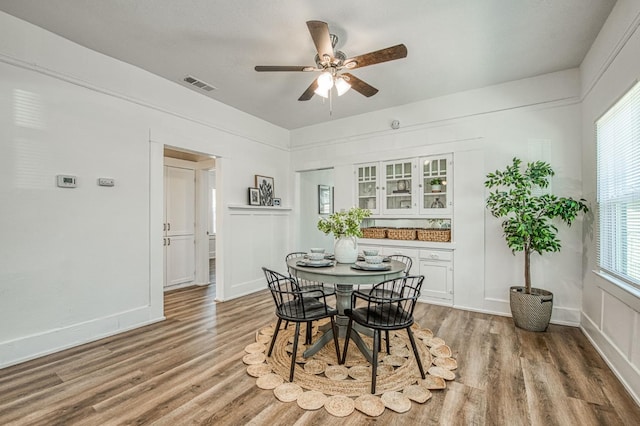 1010 N Ferger Ave, Fresno, CA 93728 - dining room featuring wood finished floors, ceiling fan, and baseboards