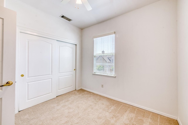 83 W Bohemia Ln, Clovis, CA 93619 - unfurnished bedroom featuring light colored carpet, a closet, baseboards, and ceiling fan