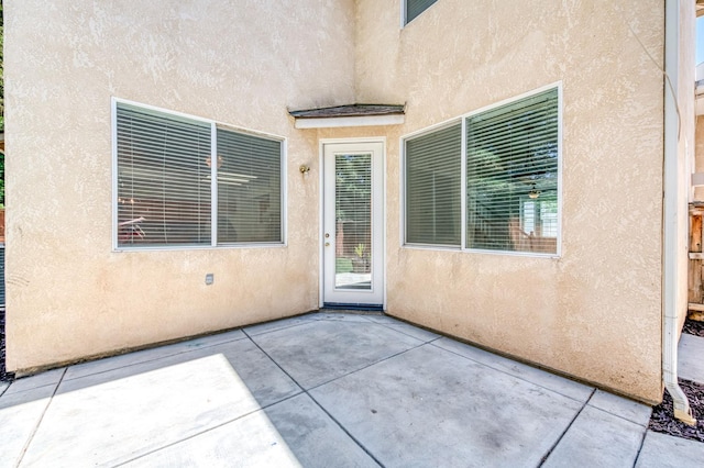 83 W Bohemia Ln, Clovis, CA 93619 - entrance to property with stucco siding and a patio