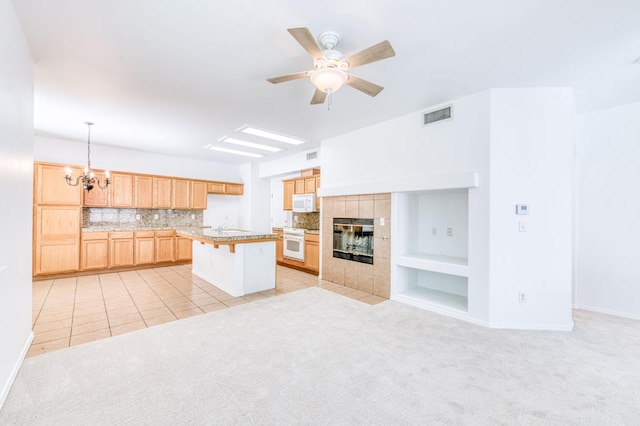 83 W Bohemia Ln, Clovis, CA 93619 - kitchen with a chandelier, light colored carpet, light countertops, and range
