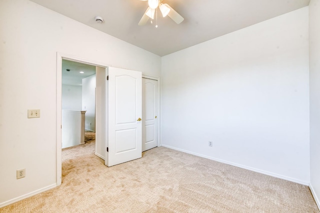 83 W Bohemia Ln, Clovis, CA 93619 - unfurnished bedroom featuring light colored carpet, baseboards, and ceiling fan