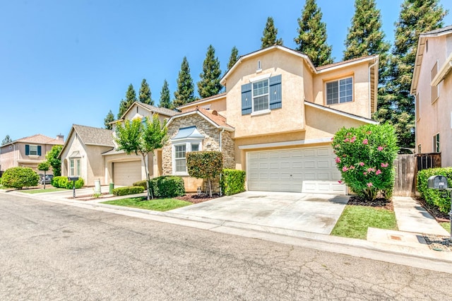 83 W Bohemia Ln, Clovis, CA 93619 - view of front facade featuring stucco siding, driveway, an attached garage, and stone siding