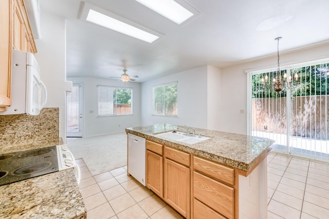 83 W Bohemia Ln, Clovis, CA 93619 - kitchen featuring a sink, white appliances, light tile patterned flooring, and light countertops