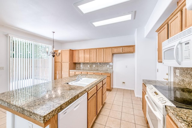 83 W Bohemia Ln, Clovis, CA 93619 - kitchen featuring white appliances, a sink, tile countertops, and tasteful backsplash
