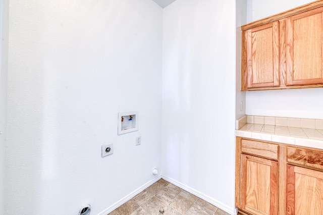 83 W Bohemia Ln, Clovis, CA 93619 - washroom featuring washer hookup, electric dryer hookup, cabinet space, and baseboards