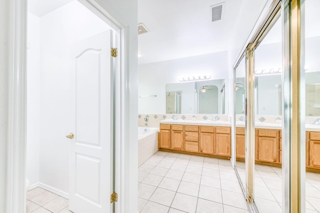 83 W Bohemia Ln, Clovis, CA 93619 - full bath featuring tile patterned flooring, a bath, and vanity